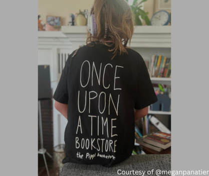 A child wearing the Pippi Bookstore Kids Shirt and showing the back.